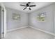 Bedroom featuring modern ceiling fan, neutral paint, and windows with wood-slat blinds at 147 Country Club Dr, Sanford, FL 32771