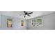 Bedroom featuring ceiling fan, neutral paint, base trim and abundant natural light at 147 Country Club Dr, Sanford, FL 32771