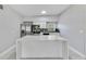 Open kitchen featuring stainless steel appliances, stylish backsplash, and a functional island at 147 Country Club Dr, Sanford, FL 32771