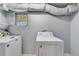 Laundry room featuring washer and dryer hookups with exposed insulated piping above at 147 Country Club Dr, Sanford, FL 32771