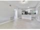 An open living room and kitchen area with modern appliances and bright lighting throughout at 147 Country Club Dr, Sanford, FL 32771
