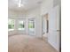 Bedroom with natural light, plush carpet, view of the pool and private access to the lanai at 15309 Markham Dr, Clermont, FL 34714