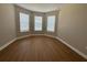 Cozy bedroom with hardwood floors and a bay window at 15569 Orchid Rose Ct, Winter Garden, FL 34787