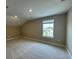 Cozy bedroom featuring neutral carpet, a window with blinds, and recessed lighting at 15569 Orchid Rose Ct, Winter Garden, FL 34787