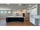 Elegant kitchen featuring a center island, modern appliances, and stylish cabinetry at 15569 Orchid Rose Ct, Winter Garden, FL 34787