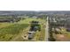 Expansive property featuring a home, outbuildings, and agricultural land at 16017 Johns Lake Rd, Clermont, FL 34711