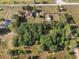 Large property featuring a house and a separate garage at 16017 Johns Lake Rd, Clermont, FL 34711