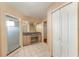 Bright bathroom with tile flooring, granite vanity and countertop, and a glass enclosed shower at 16017 Johns Lake Rd, Clermont, FL 34711