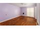 Bedroom with hardwood floor, ceiling fan, and natural light from the windows at 16017 Johns Lake Rd, Clermont, FL 34711