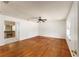 Bedroom with hardwood floors and a view into bathroom at 16017 Johns Lake Rd, Clermont, FL 34711