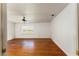 Bedroom with hardwood floors, window, and doorway at 16017 Johns Lake Rd, Clermont, FL 34711
