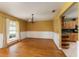 Bright dining area with natural light, chandelier, and view into kitchen area at 16017 Johns Lake Rd, Clermont, FL 34711