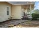 Lovely exterior featuring a covered porch with ceiling fans, surrounded by lush greenery and a tranquil setting at 16017 Johns Lake Rd, Clermont, FL 34711