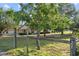 Beautiful property with charming home, mature trees, and a wooden fence, providing a peaceful and inviting atmosphere at 16017 Johns Lake Rd, Clermont, FL 34711