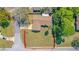 Aerial view of a home with a fenced yard, mature trees, and a well-maintained lawn at 1842 Evergreen Dr, Edgewater, FL 32141