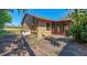 View of the backyard of a single-Gathering home with mature trees and a screened-in patio at 1842 Evergreen Dr, Edgewater, FL 32141
