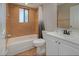 Cozy bathroom with tiled shower-tub and a vanity with a white countertop at 1842 Evergreen Dr, Edgewater, FL 32141