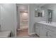 The bathroom features updated vanity with double sinks and a bright, clean shower/tub combo at 1842 Evergreen Dr, Edgewater, FL 32141