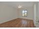 Bright bedroom featuring hardwood floors, a ceiling fan, and natural light at 1842 Evergreen Dr, Edgewater, FL 32141