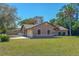 Well-maintained single-Gathering home with a large front yard and a two-car garage at 1842 Evergreen Dr, Edgewater, FL 32141