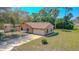 Well-maintained home featuring an attached two-car garage and a neatly landscaped front yard at 1842 Evergreen Dr, Edgewater, FL 32141