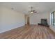 Spacious living room featuring hardwood floors, a modern fireplace, and plenty of natural light at 1842 Evergreen Dr, Edgewater, FL 32141