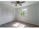 Bedroom features new flooring, ceiling fan and a window providing natural light at 221 E Fern Dr, Orange City, FL 32763