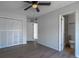 Bedroom featuring a large closet and connected bathroom with tiled shower at 221 E Fern Dr, Orange City, FL 32763