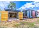 Exterior of the home with a two car garage and well maintained landscaping at 221 E Fern Dr, Orange City, FL 32763
