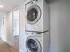 Stacked washer and dryer inside a laundry closet at 221 E Fern Dr, Orange City, FL 32763