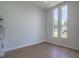 View of the open-concept living room featuring recessed lighting and large windows allowing natural light to enter the space at 221 E Fern Dr, Orange City, FL 32763