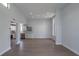 Open floor plan featuring an eat-in kitchen with stainless steel appliances and a large living area with luxury vinyl flooring at 221 E Fern Dr, Orange City, FL 32763