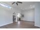Open floor plan showcasing the connection between living room and kitchen with stainless steel appliances and recessed lighting at 221 E Fern Dr, Orange City, FL 32763