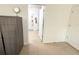 Bedroom featuring neutral tile floors, doorway to bathroom with glass shower at 238 Miniehaha Cir, Haines City, FL 33844