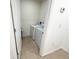 Small laundry room with tile flooring featuring a full sized washer and dryer at 238 Miniehaha Cir, Haines City, FL 33844
