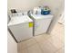 Laundry room with tile flooring featuring a full-sized washer and dryer at 238 Miniehaha Cir, Haines City, FL 33844