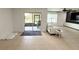 Living area with screened porch, modern couch, and media center at 238 Miniehaha Cir, Haines City, FL 33844