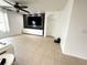 Open living room area with television, recessed lights and access to other rooms at 238 Miniehaha Cir, Haines City, FL 33844
