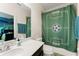 Bathroom with a green soccer-themed shower curtain at 2401 Oxmoor Dr, Deland, FL 32724