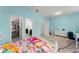 Cozy bedroom showcases tiled floors, walk-in closet, and playful decor accents at 2401 Oxmoor Dr, Deland, FL 32724