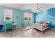 Bright bedroom with blue walls, a whimsical mural, and charming decor at 2401 Oxmoor Dr, Deland, FL 32724