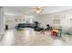 Spacious bonus room offers tile floors, ceiling fans, and versatile space for recreation and fitness at 2401 Oxmoor Dr, Deland, FL 32724