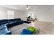 Expansive bonus room featuring tile flooring, comfortable seating, and a fun play area at 2401 Oxmoor Dr, Deland, FL 32724