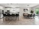 This spacious eat-in kitchen features stainless appliances, a center island with seating, and a dining area at 2401 Oxmoor Dr, Deland, FL 32724