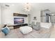 Spacious living room with contemporary decor, featuring an entertainment center, and comfortable seating at 2401 Oxmoor Dr, Deland, FL 32724