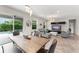 Bright open floor plan with modern furniture and an oversized sliding door to the outdoor patio at 2401 Oxmoor Dr, Deland, FL 32724