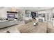 Open living space with a contemporary design seamlessly connects the kitchen, dining, and living areas at 2401 Oxmoor Dr, Deland, FL 32724