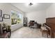 Bright home office featuring a large window, neutral walls, and tile flooring at 2401 Oxmoor Dr, Deland, FL 32724