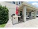 Outdoor kitchen and bar area offers a perfect spot for dining and entertaining by the pool at 2401 Oxmoor Dr, Deland, FL 32724
