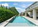 Backyard featuring a pool, patio, and playhouse at 2401 Oxmoor Dr, Deland, FL 32724